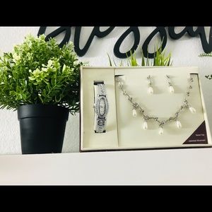 A cute combo of necklace, earrings and a watch